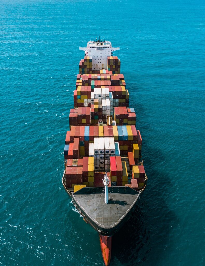 Shipping containers at a major port reflect a global trade system under restructuring.
